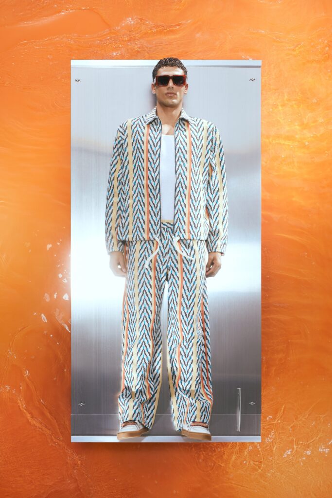 A relaxed fit multicolor striped jacket with matching pants, featuring a collared design.