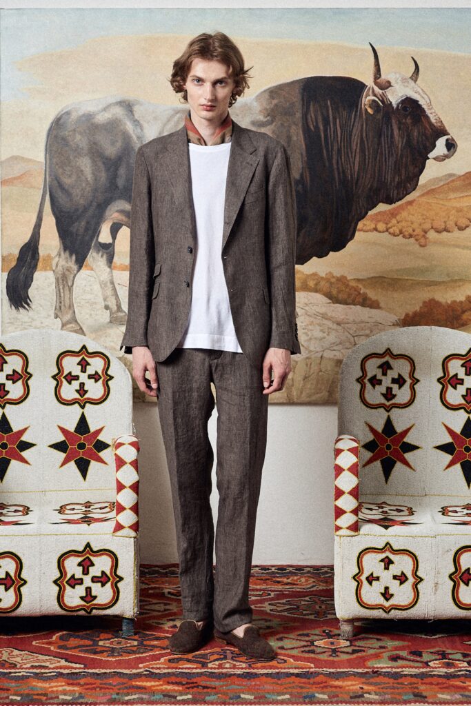 A tailored brown linen suit with a collared long-sleeve shirt and buttoned details.