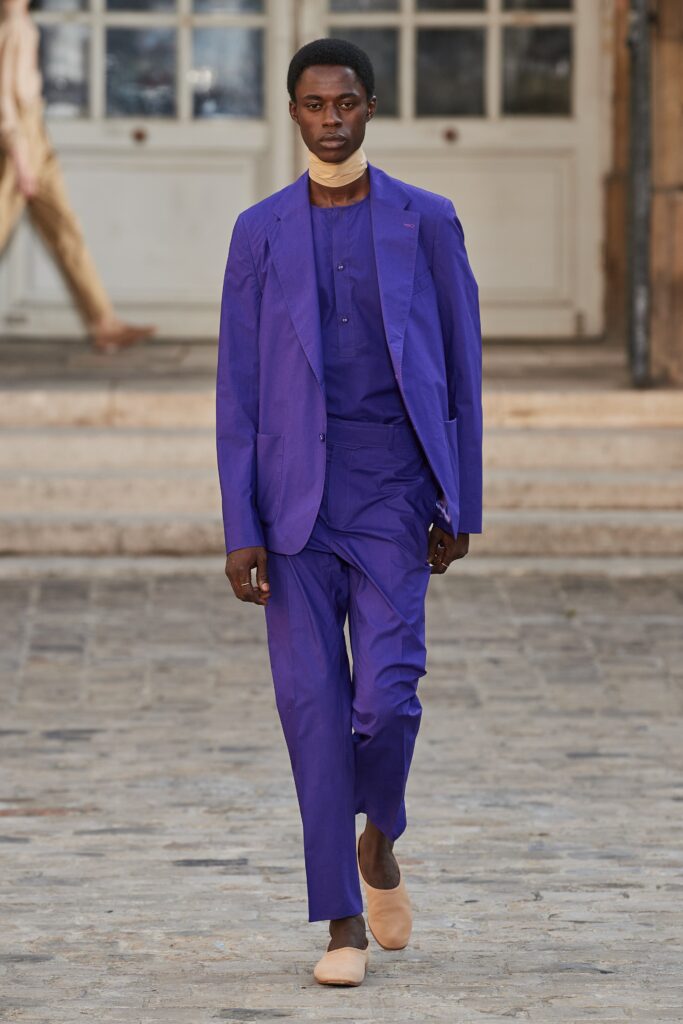 purple tailored suit with beige shoes