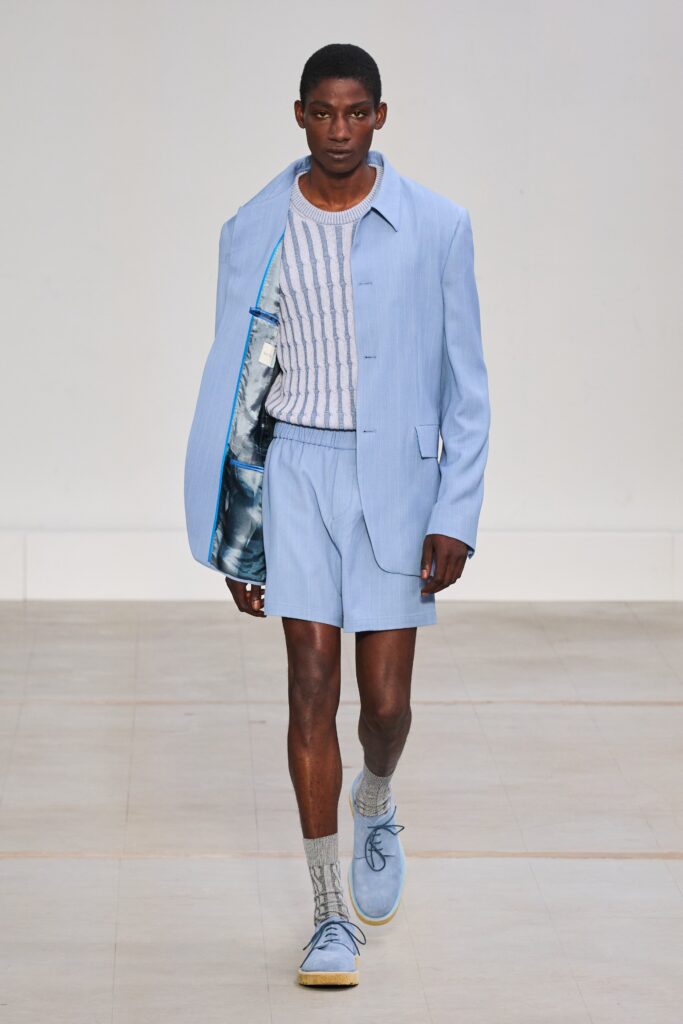 A relaxed blue cotton jacket with a collared design paired with matching shorts.