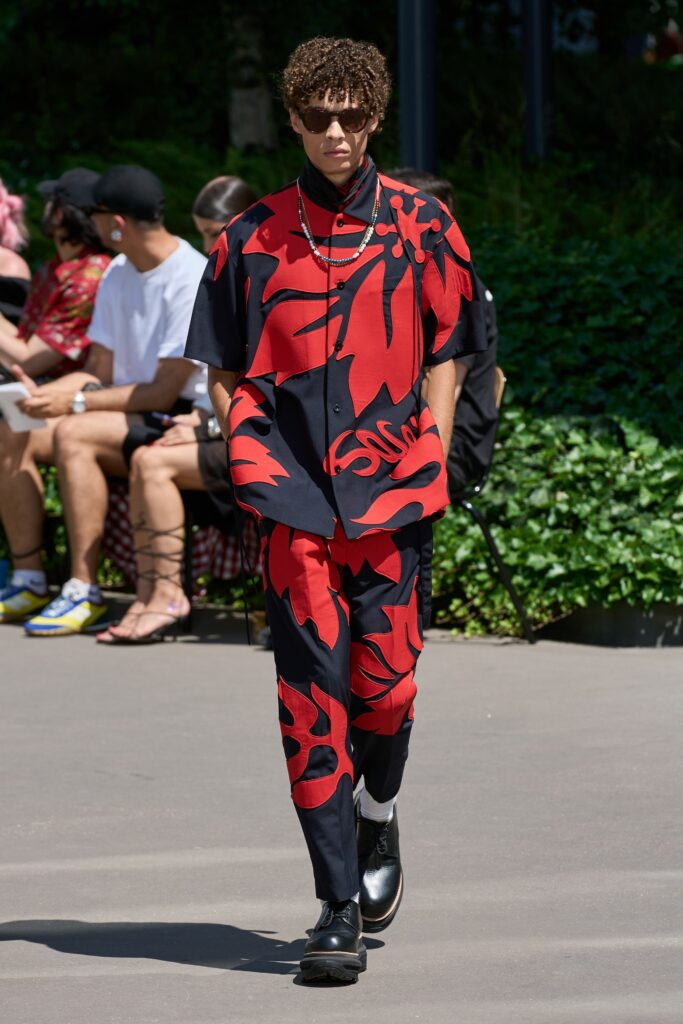 A relaxed fit red and black printed shirt with short sleeves and matching pants.