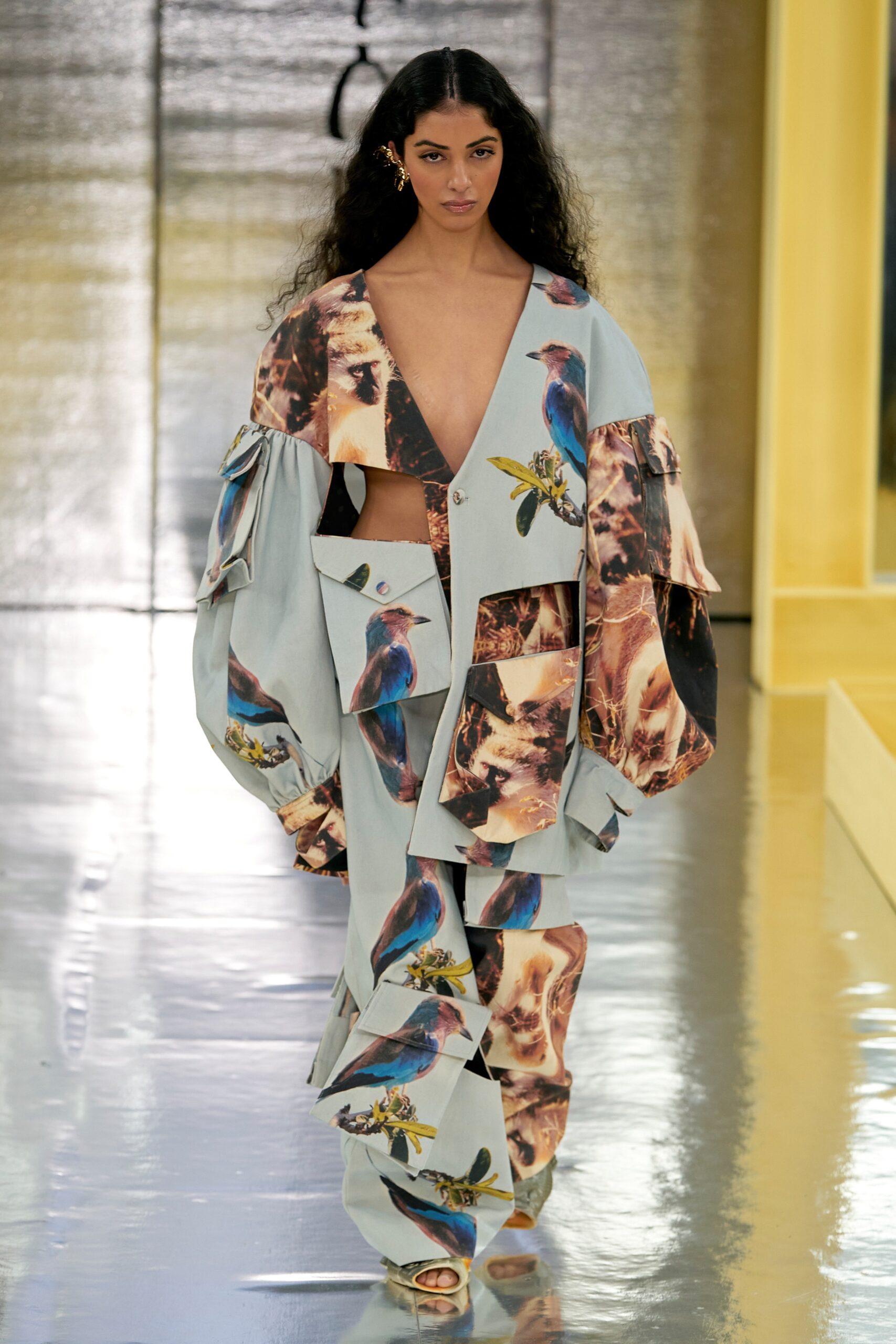 A relaxed blue printed jacket with long sleeves and matching pants, featuring a V-neckline.
