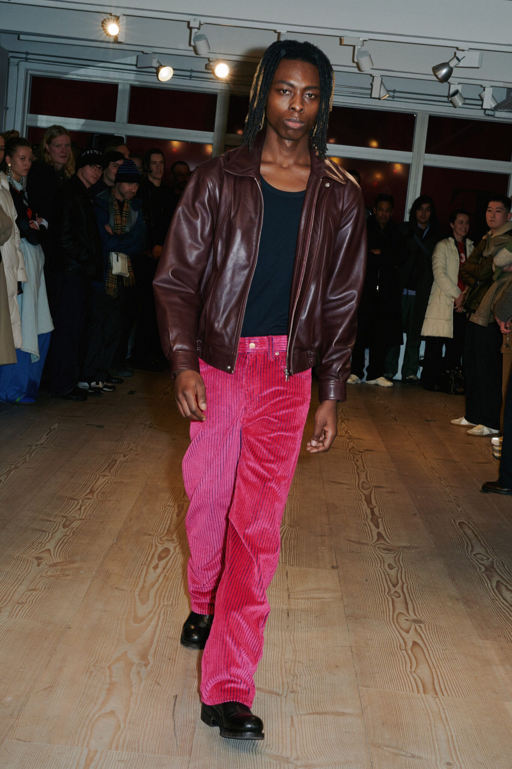 brown leather jacket with red pants