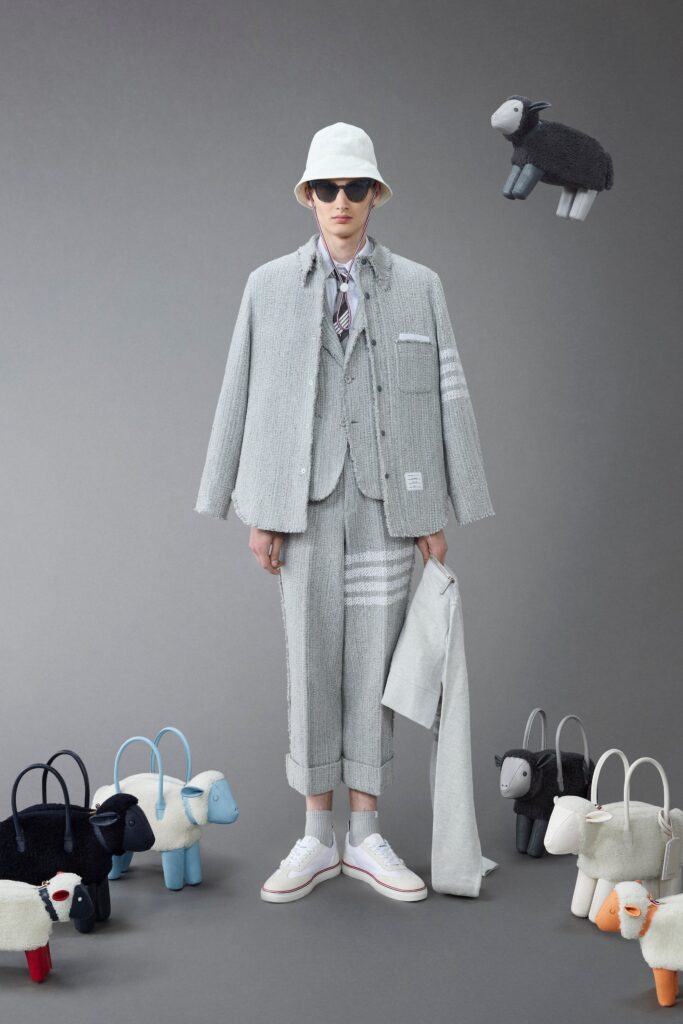 A relaxed gray cotton jacket with stripes, paired with high-waisted pants.