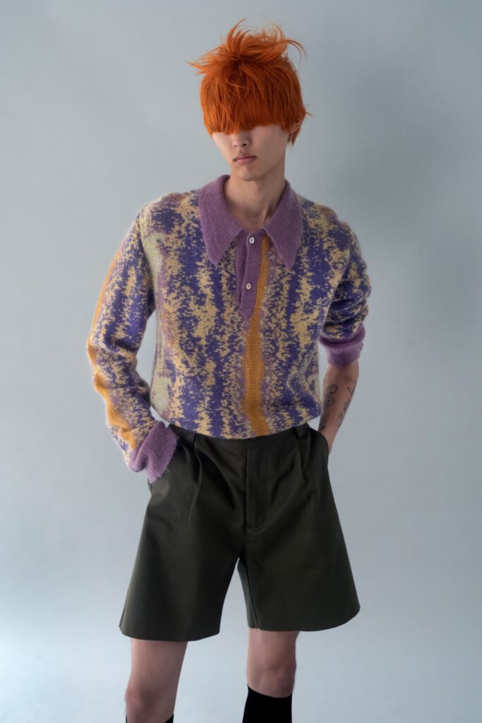 purple and yellow printed sweater with green shorts