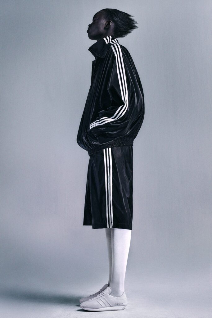 A relaxed black jacket with stripes paired with matching black shorts.