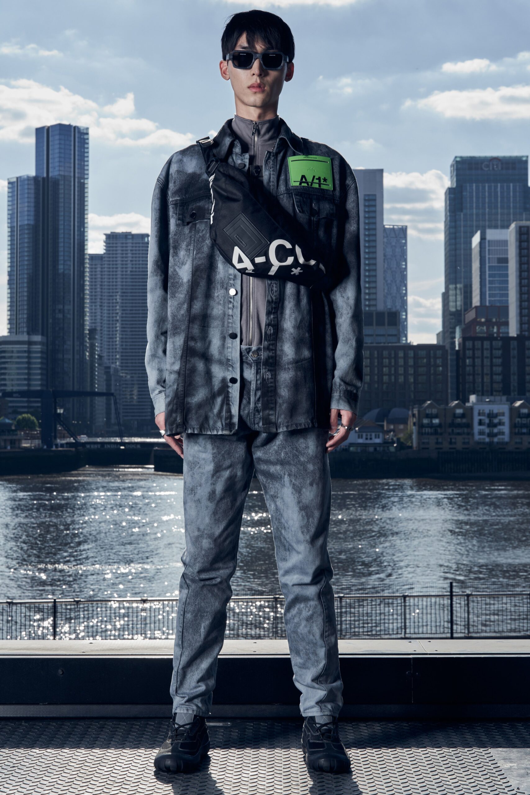 A fitted gray denim long-sleeve shirt with a collar and matching pants featuring a printed design.