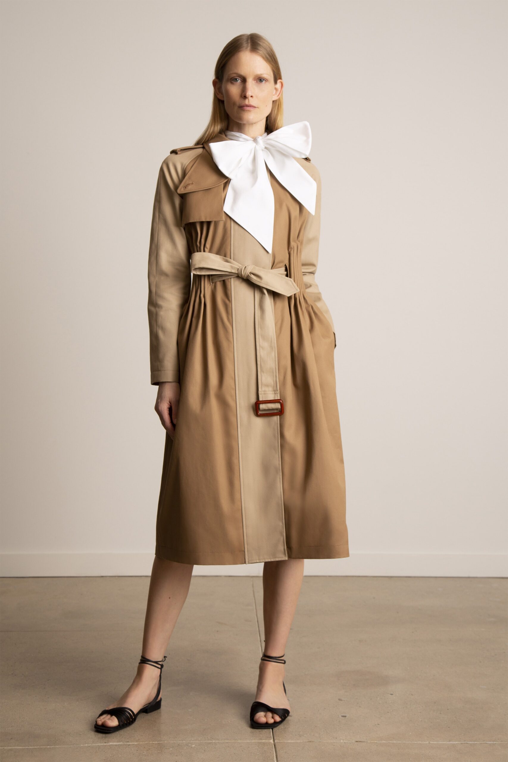 beige trench coat with white blouse