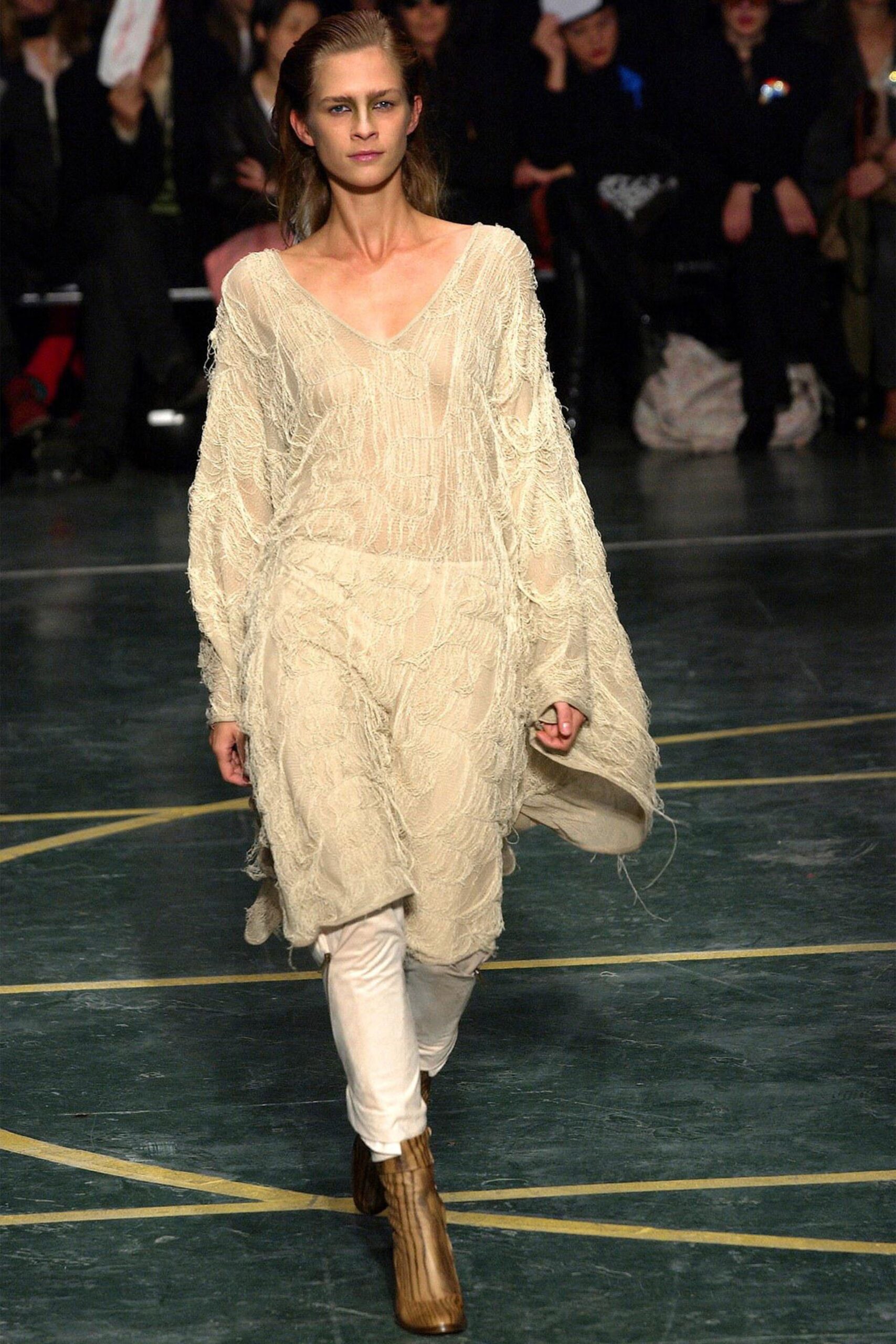 beige fringed top with white pants
