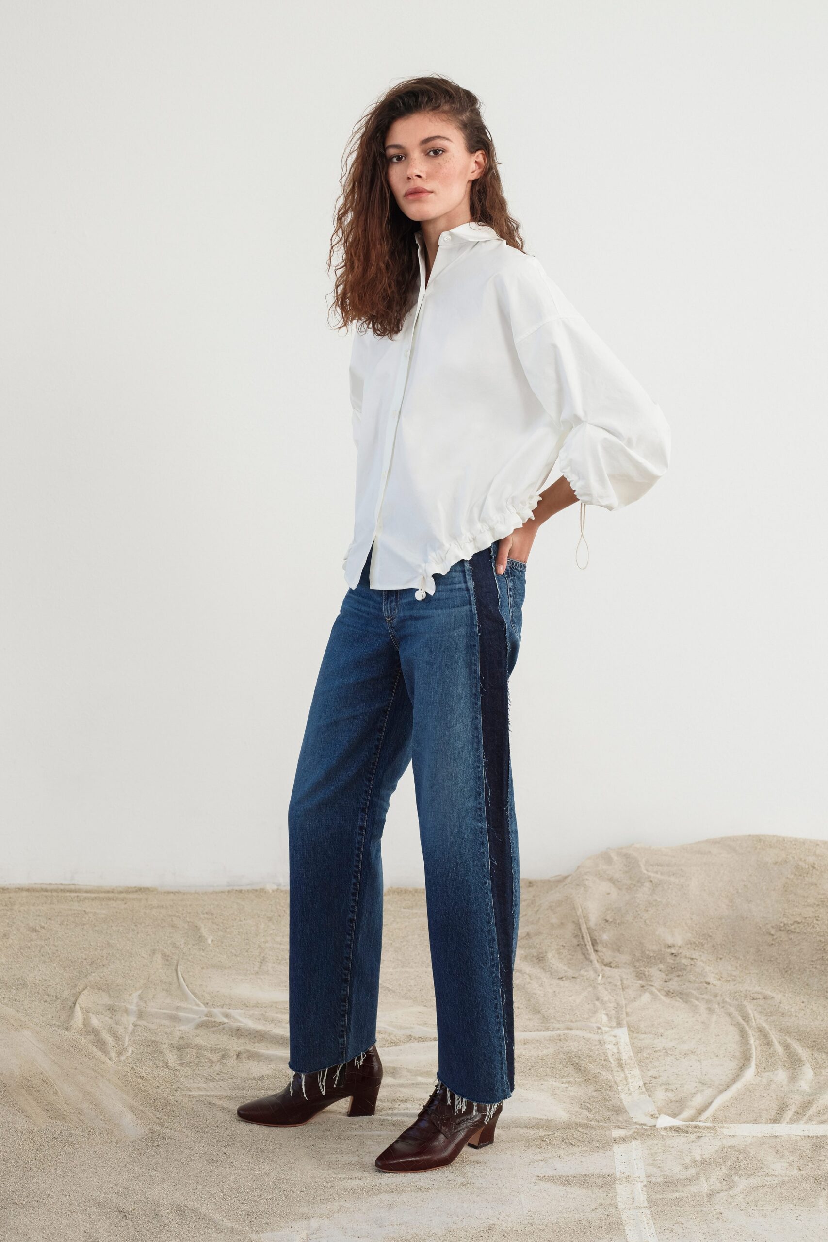 white relaxed shirt with blue tailored pants