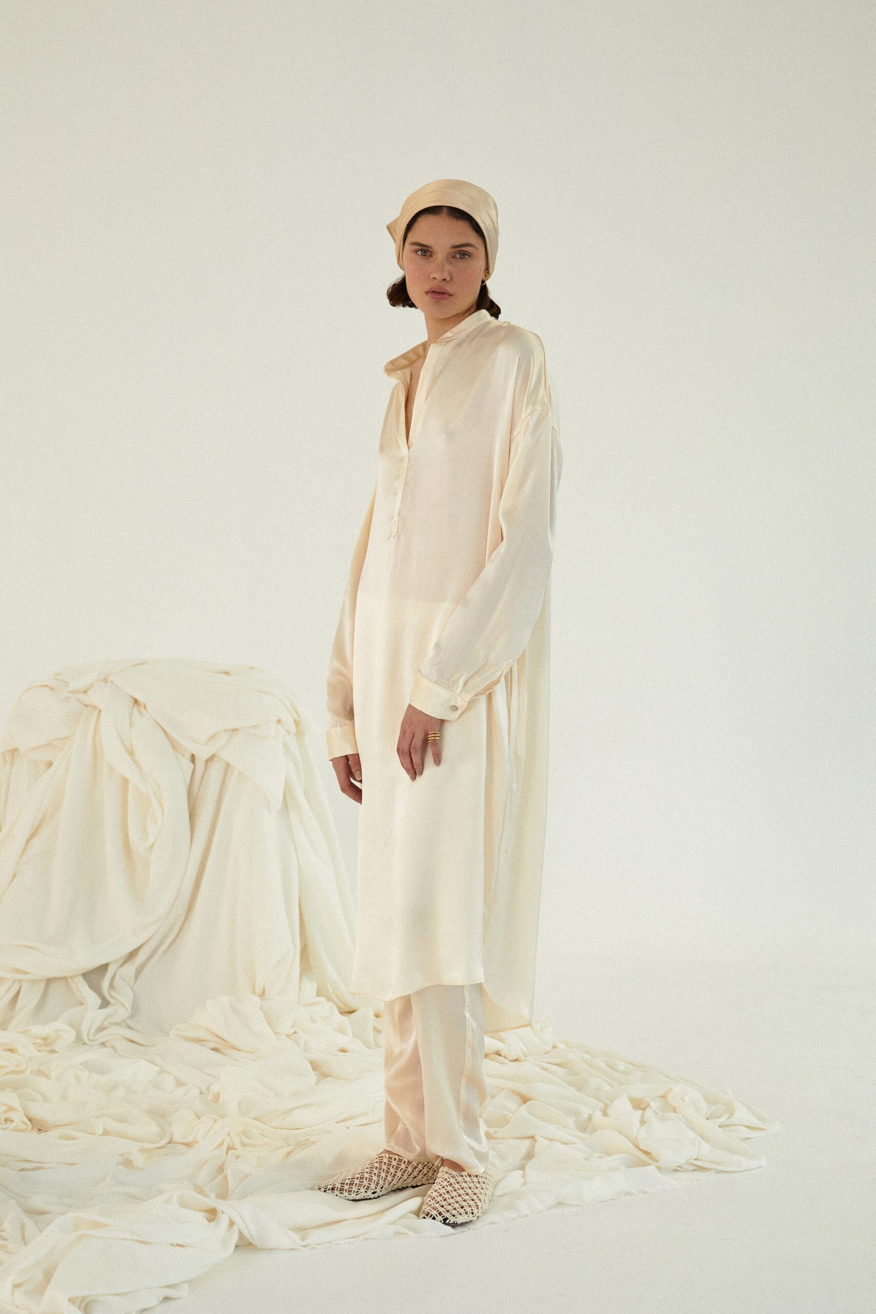 white silk long-sleeve collared relaxed buttoned draped shirt-dress