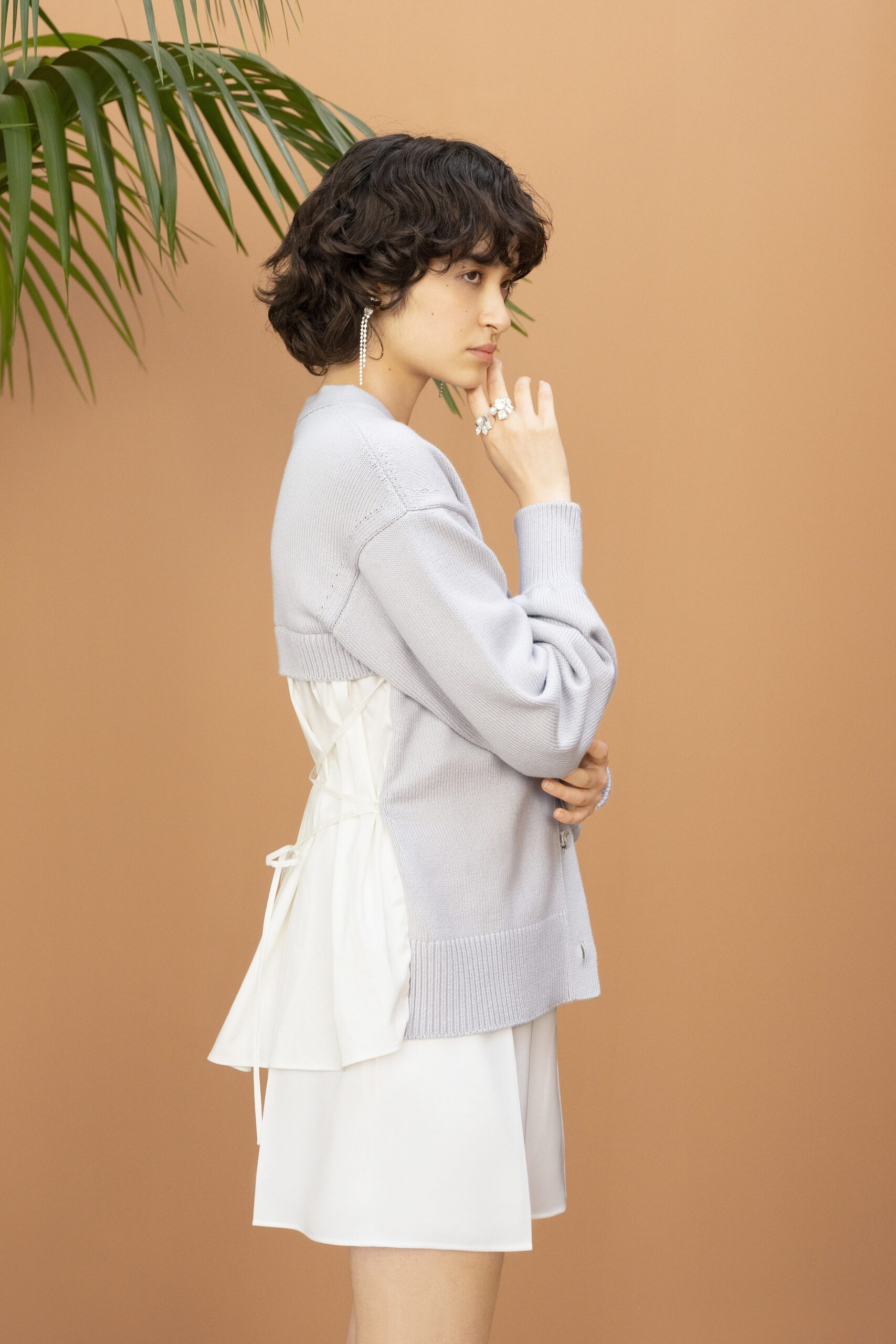 gray cardigan over white dress