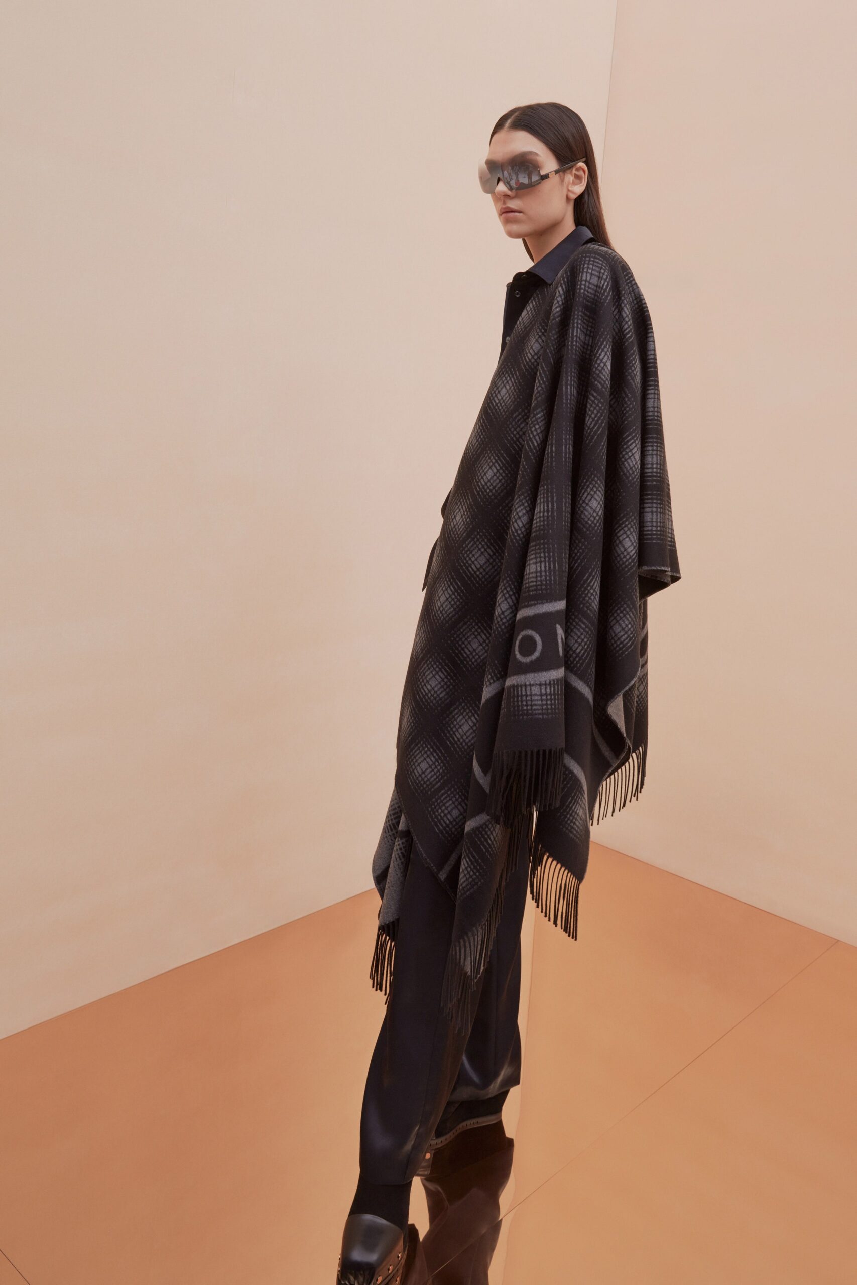 black gray wool poncho with fitted pants