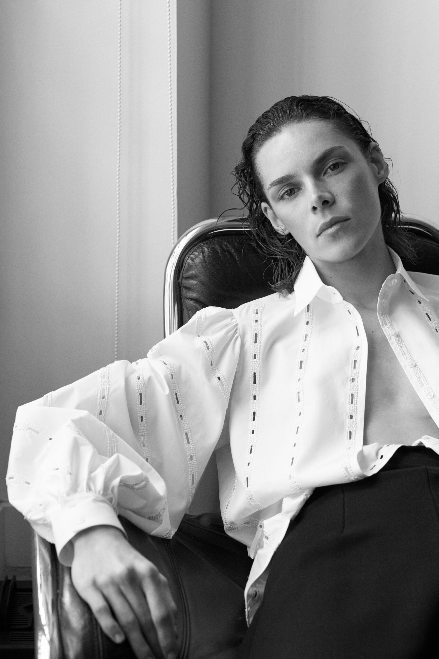 white embroidered shirt and black tailored pants