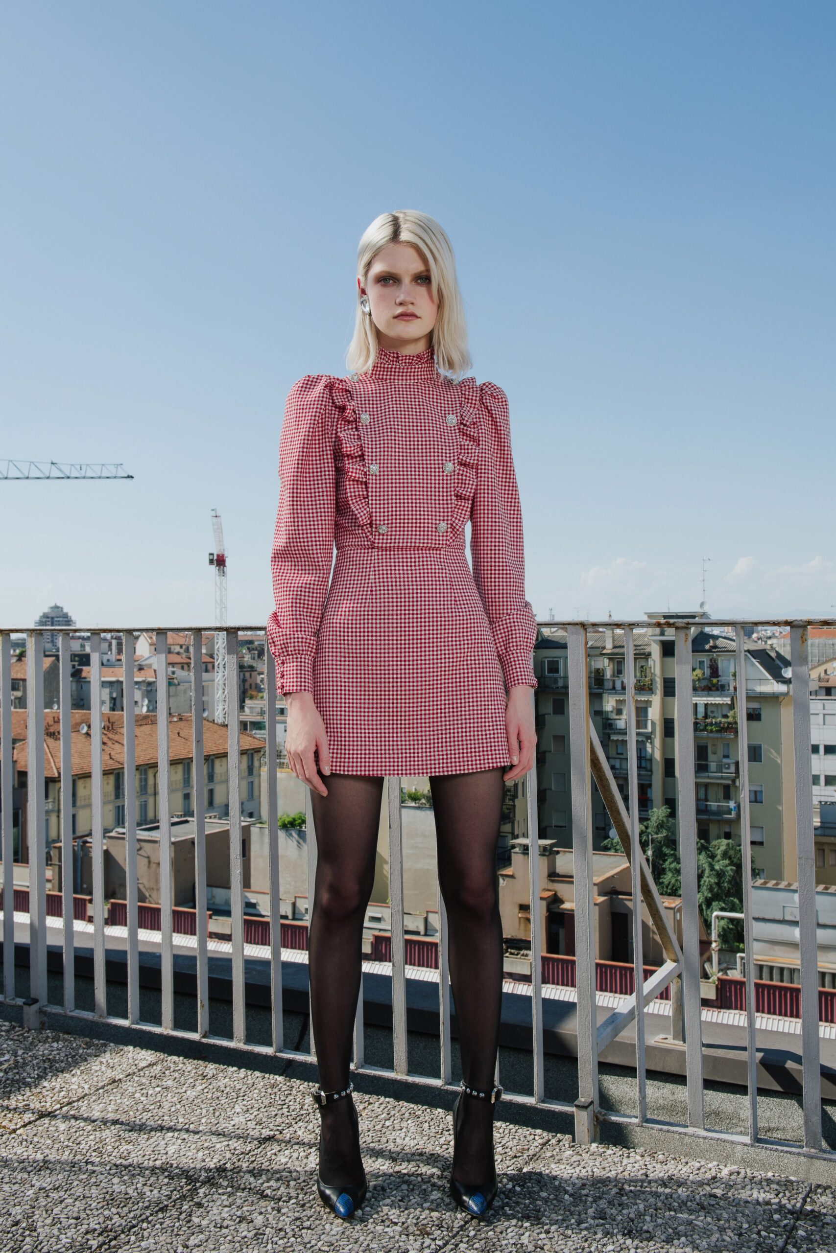 red cotton long-sleeve collared fitted pleated buttoned dress