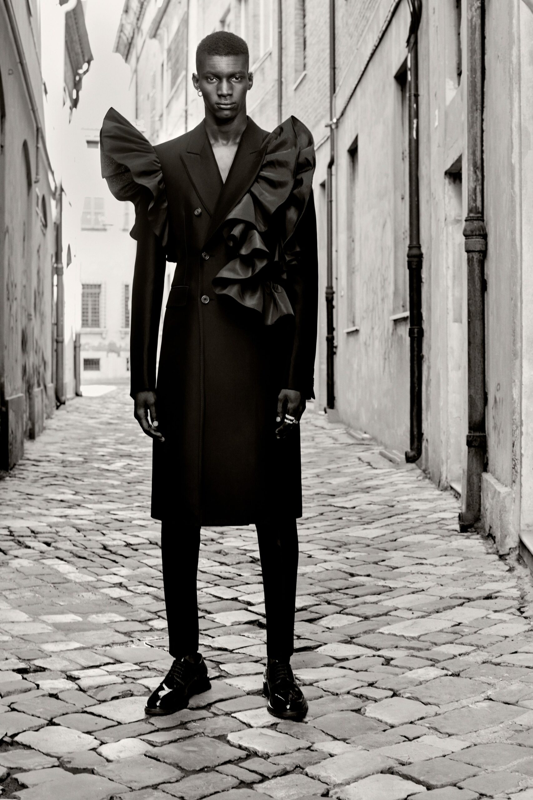 black fitted coat with ruffles