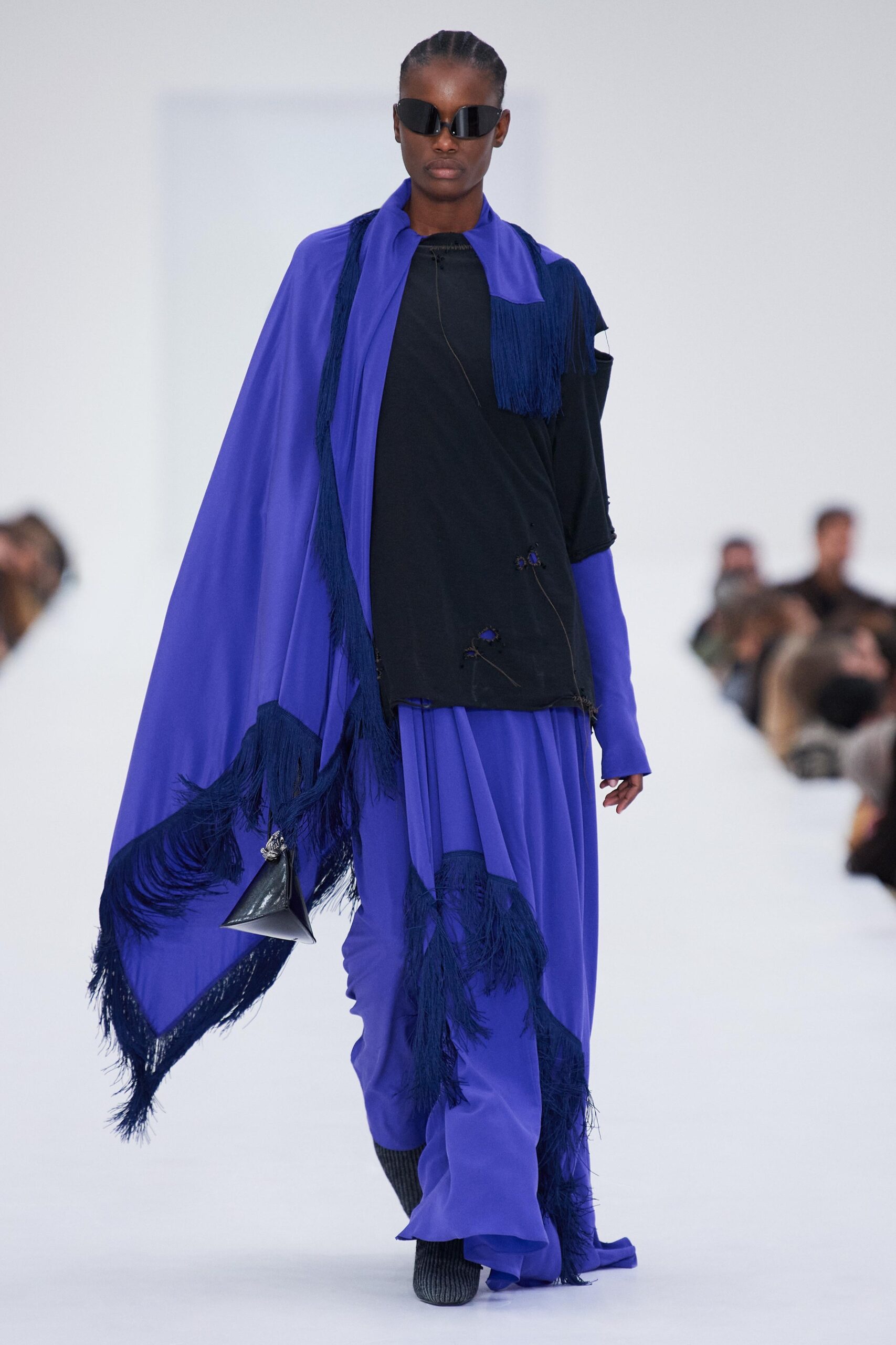 black top blue pants cape