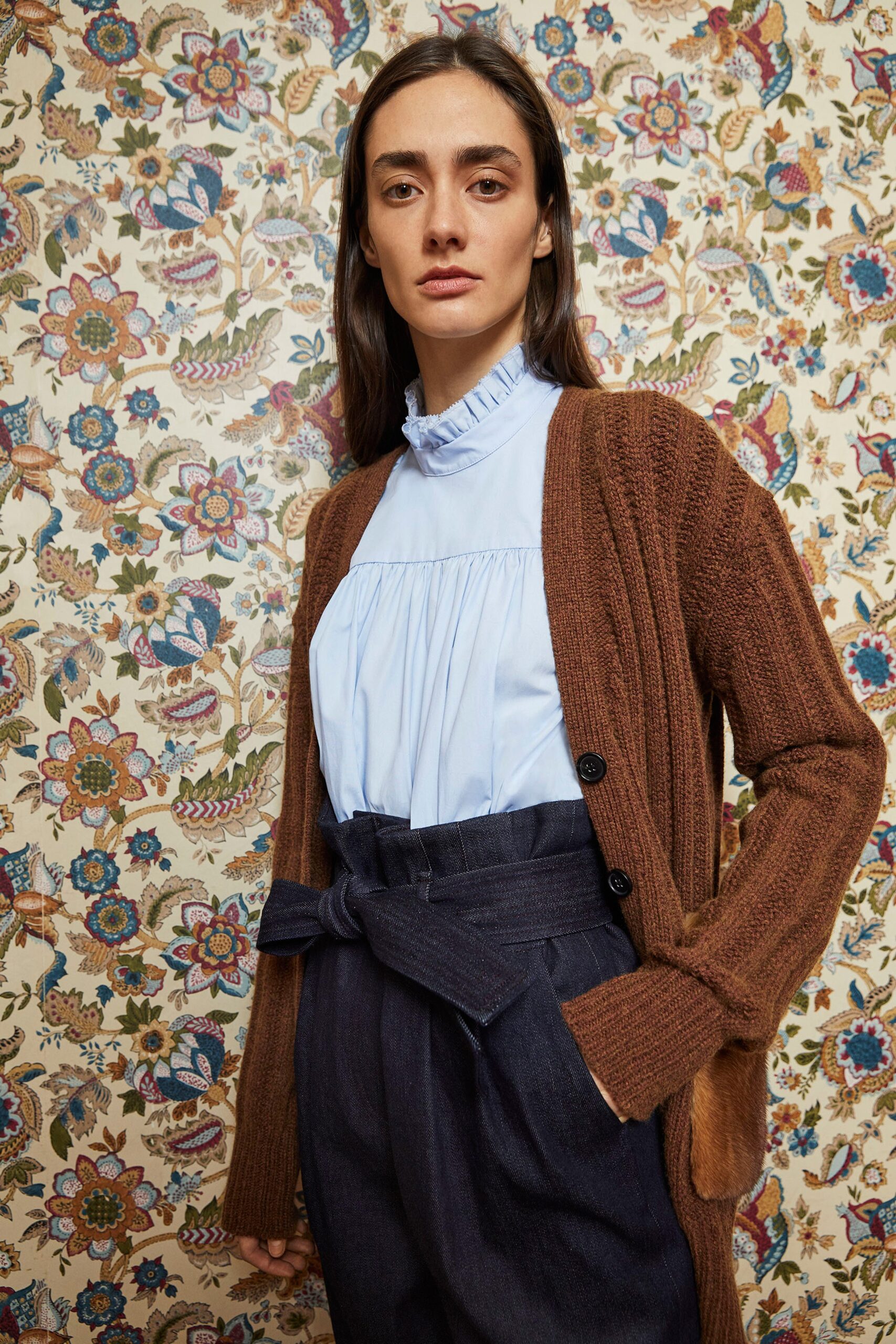 brown cardigan blue blouse gray pants