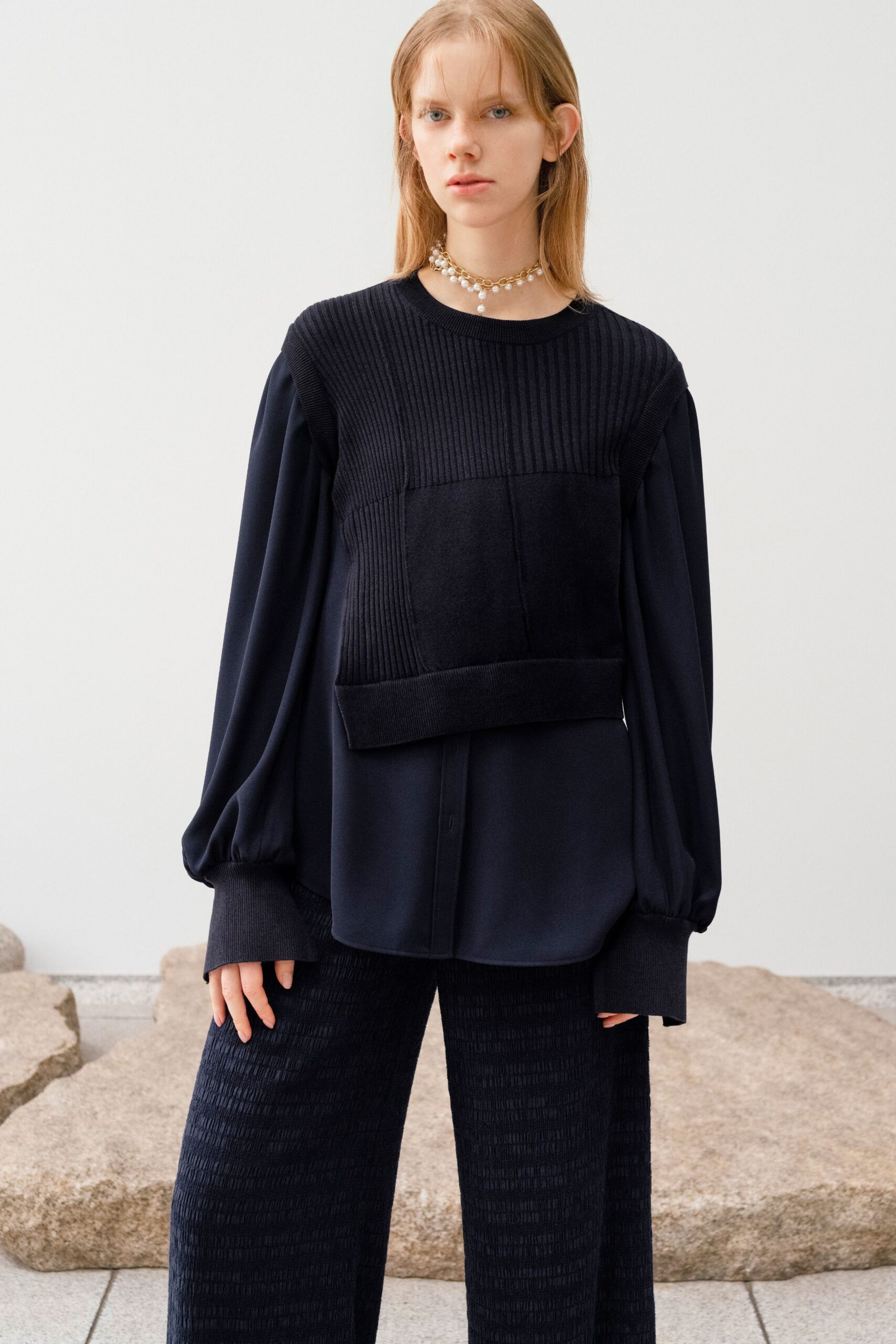 black fitted top and relaxed pants