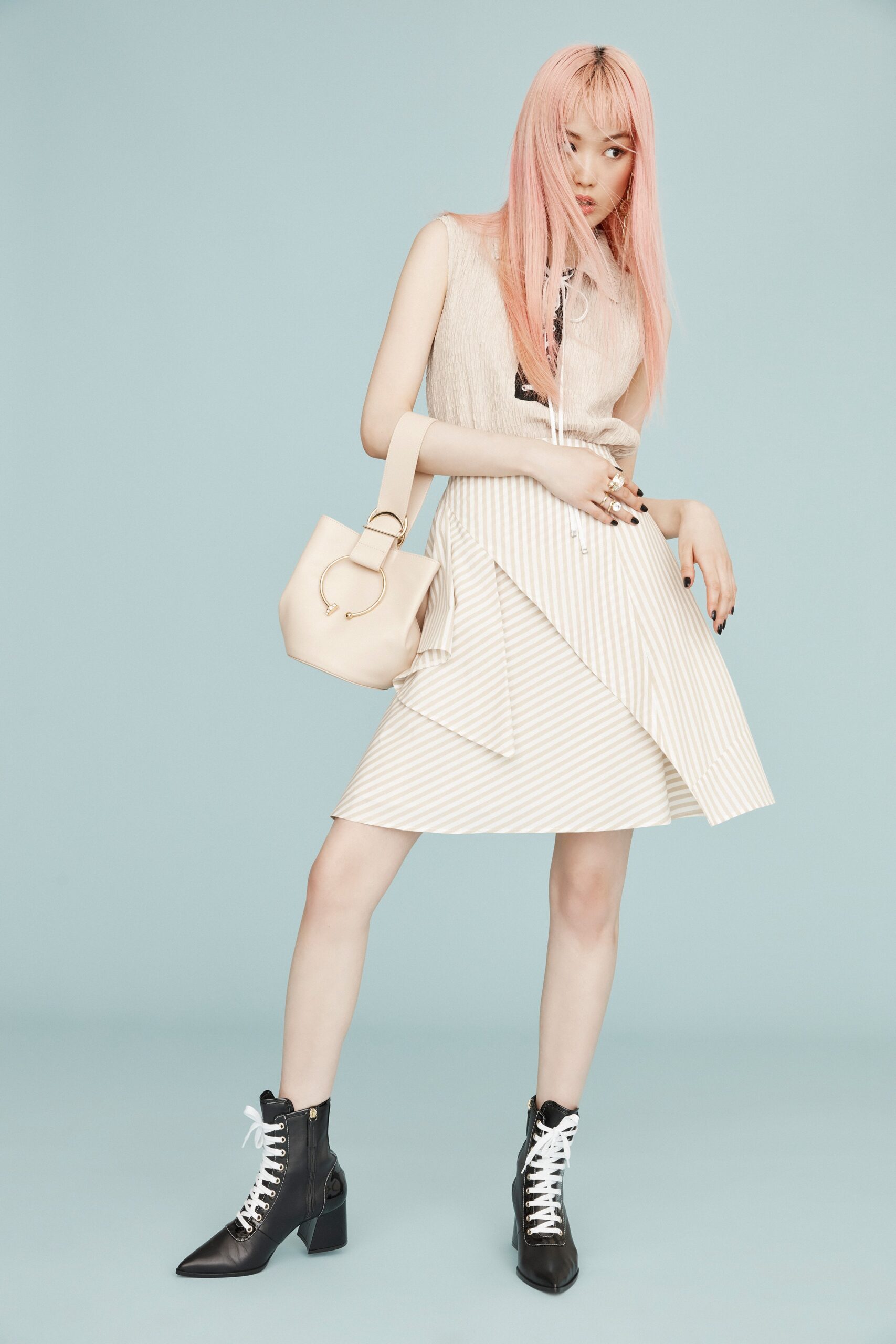 beige sleeveless top with striped skirt