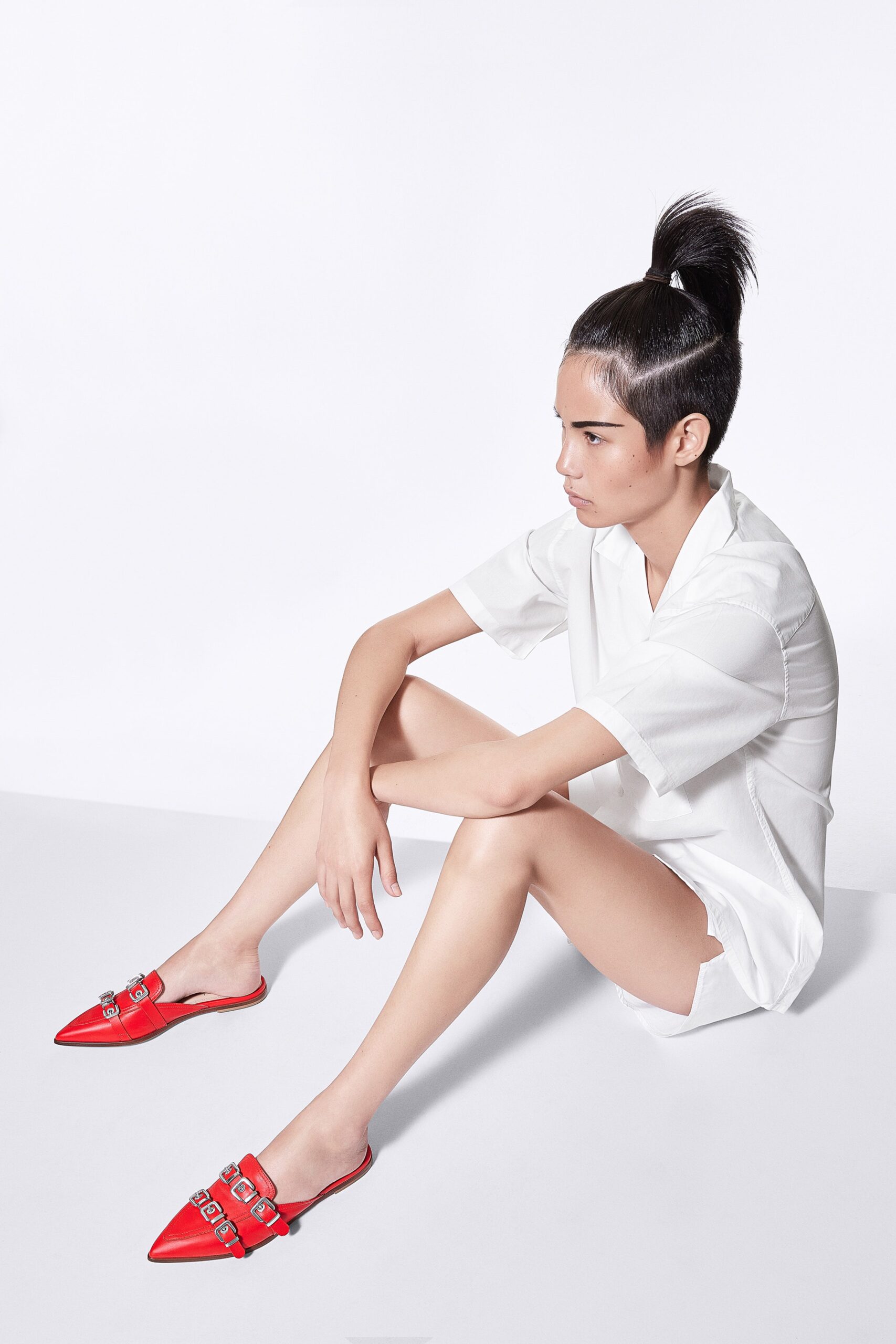 white relaxed shirt and red shoes