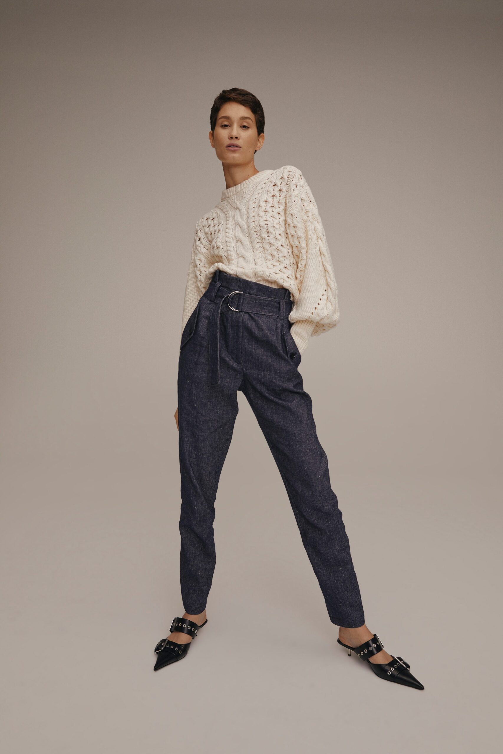 white knit sweater with tailored pants