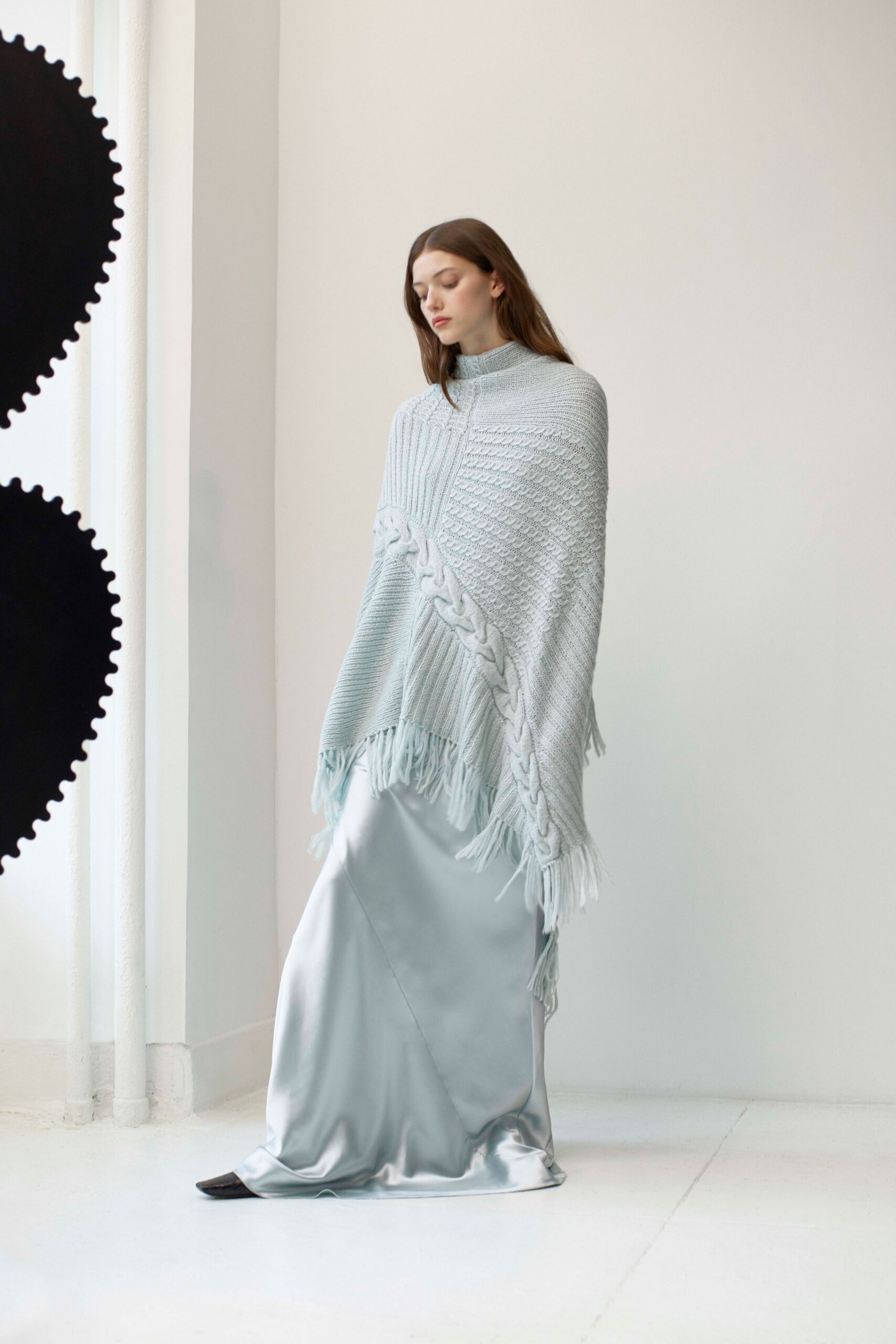 light blue wool poncho and silver satin skirt