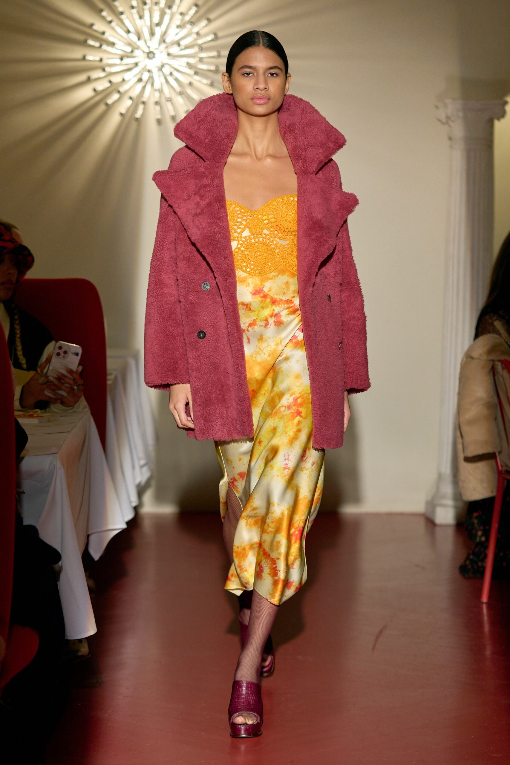 red faux-fur coat and yellow dress