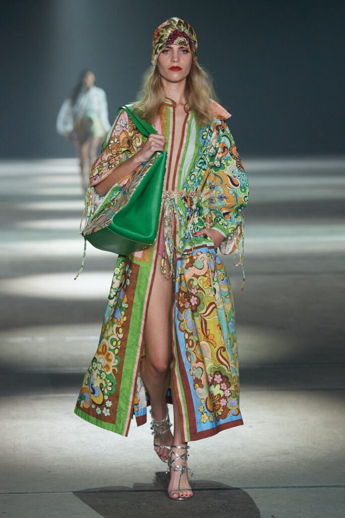 A relaxed multicolor silk dress with long sleeves and a V-neckline featuring a vibrant printed design.