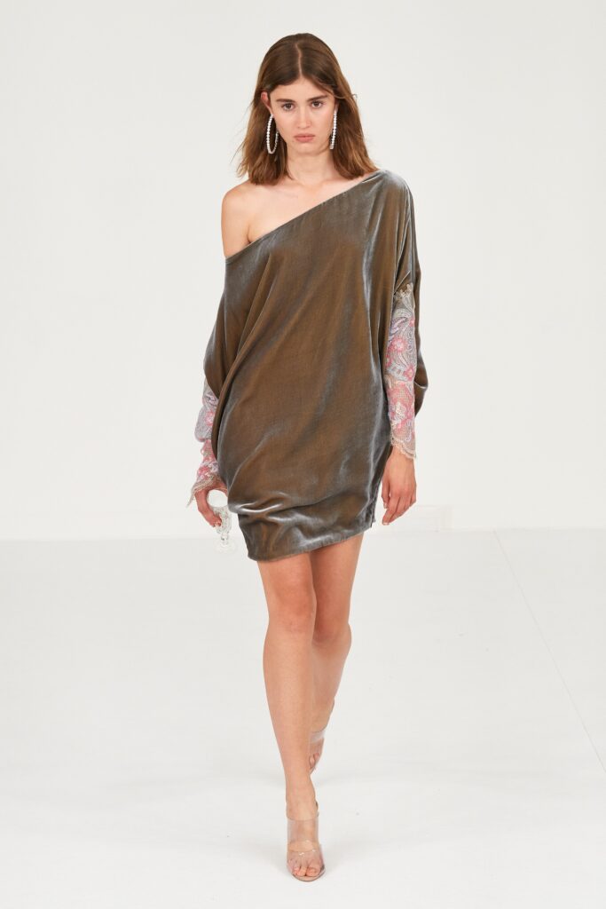 A relaxed gray silk dress with long sleeves and an asymmetric design.