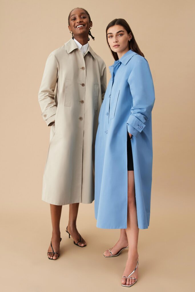Two relaxed coats in beige and blue with long sleeves and buttoned details.