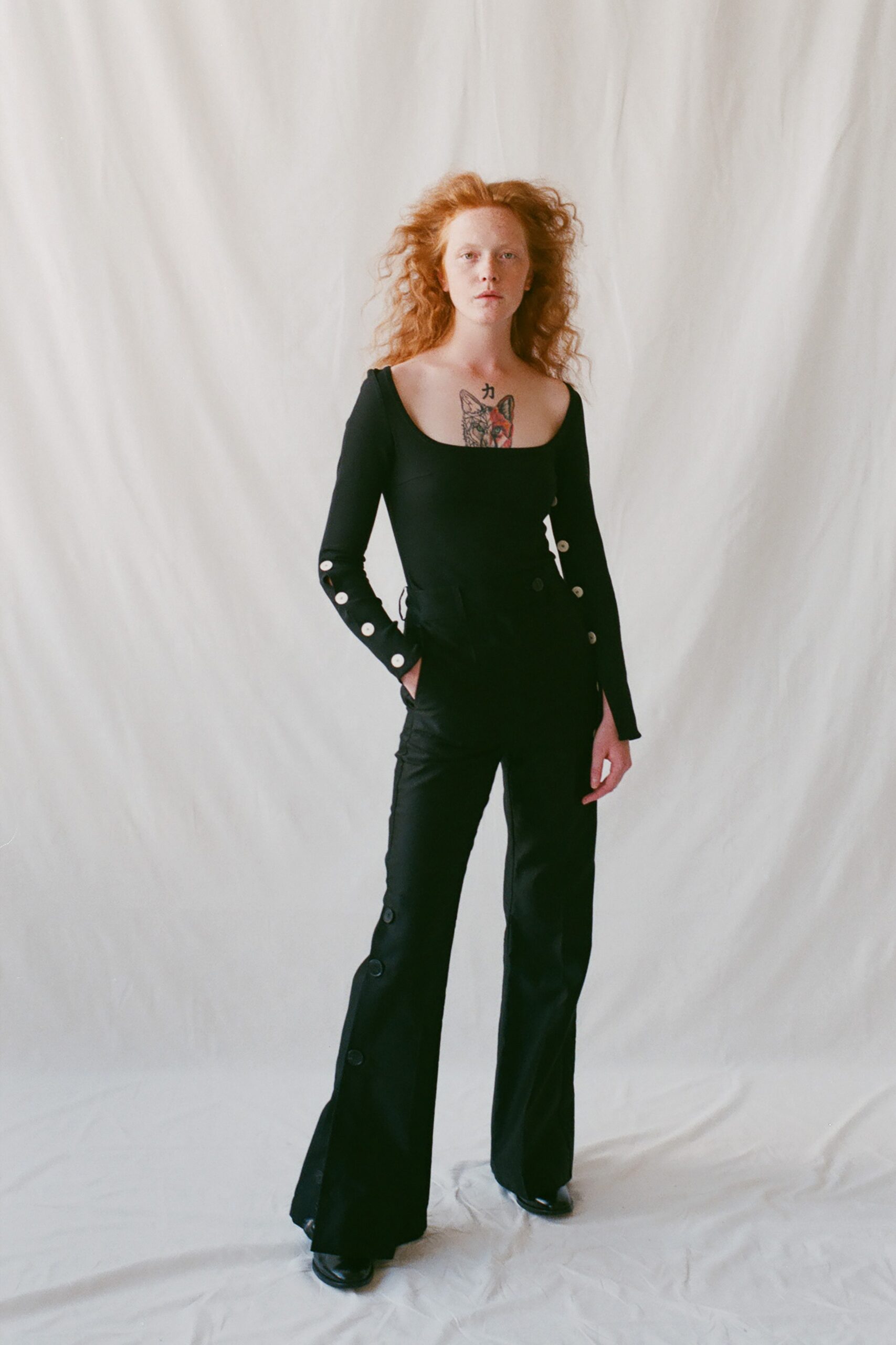 black cotton fitted flared buttoned pants