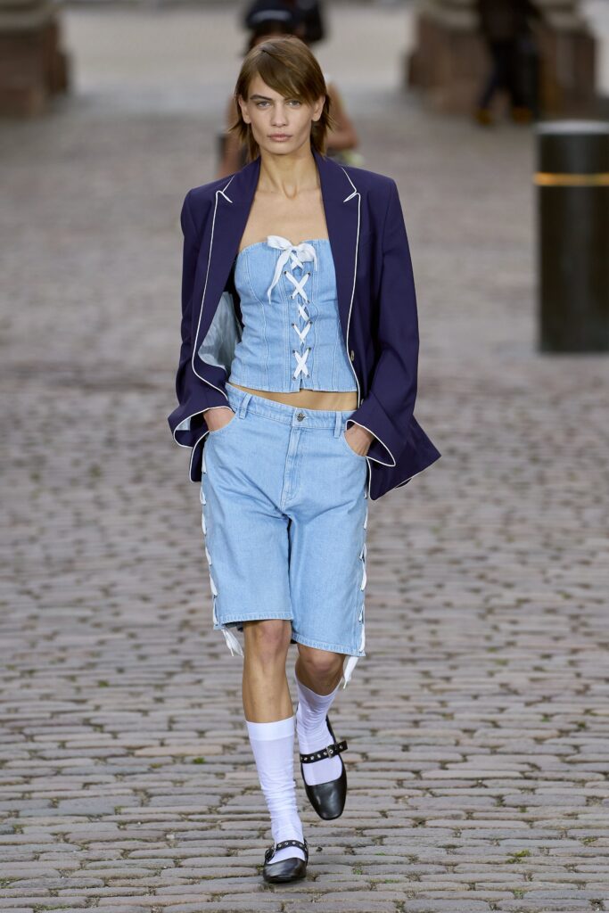 navy blazer with denim corset and shorts