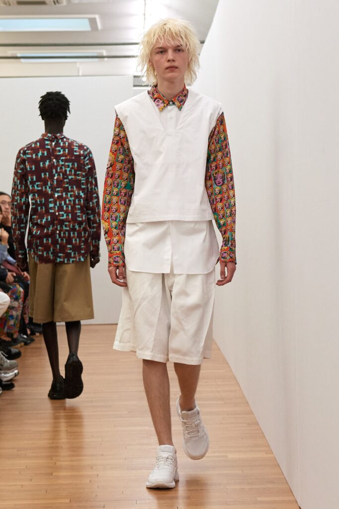 A relaxed white shirt with short sleeves paired with matching shorts for a casual look.