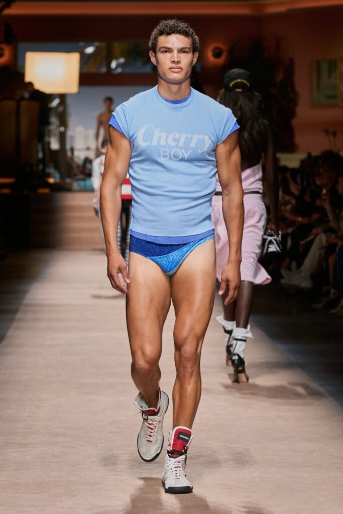 A fitted blue t-shirt with a printed design paired with a matching swimsuit.