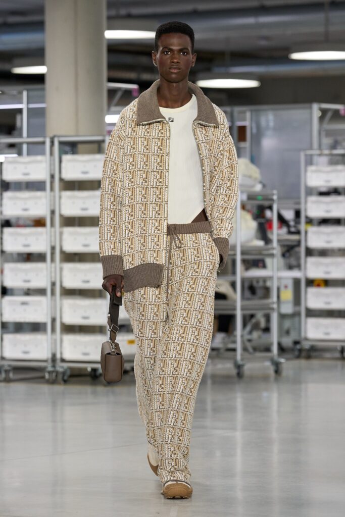 A relaxed beige printed jacket with long sleeves paired with matching pants.