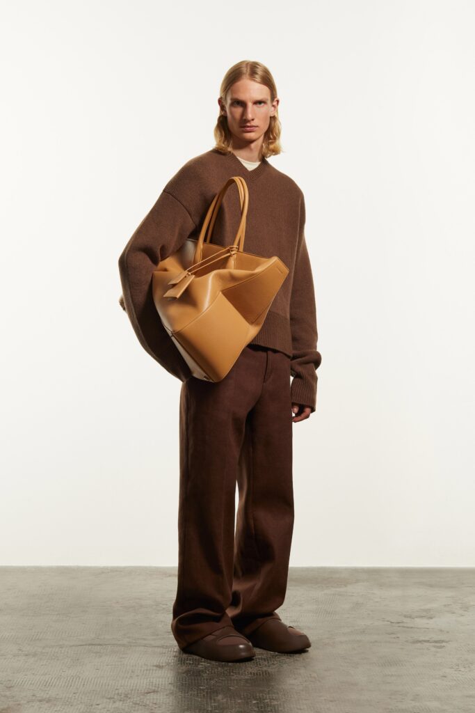 A relaxed brown wool sweater paired with wide-leg brown pants for a stylish look.