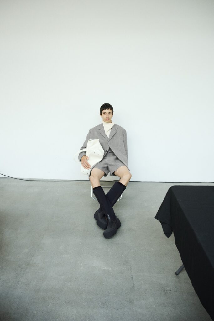 A gray tailored oversized blazer paired with matching shorts, creating a chic and modern look.