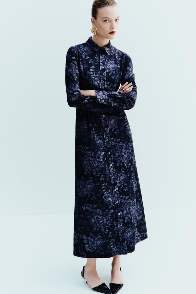 A relaxed blue floral long-sleeve dress with a collared neckline.