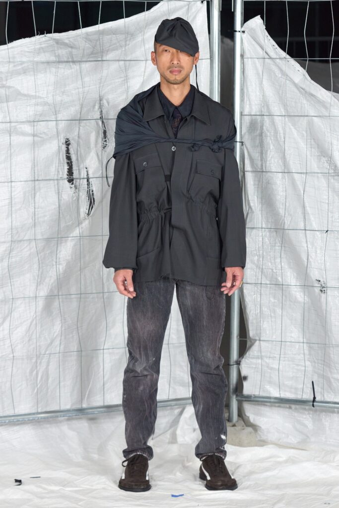 black relaxed jacket with gray pants