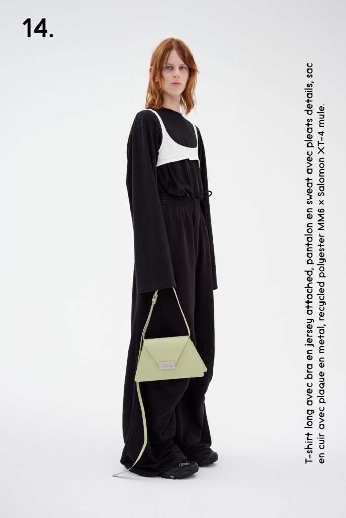A relaxed black cotton outfit featuring a long-sleeve top with a layered design.