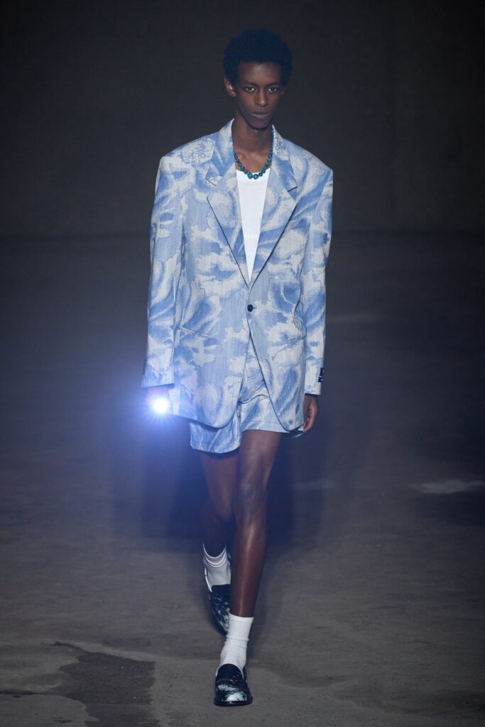 A relaxed blue printed suit with a collared short-sleeve shirt.