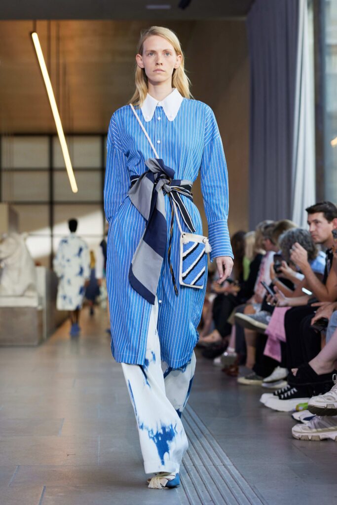 A blue and white striped dress with long sleeves and coordinating pants for a stylish look.