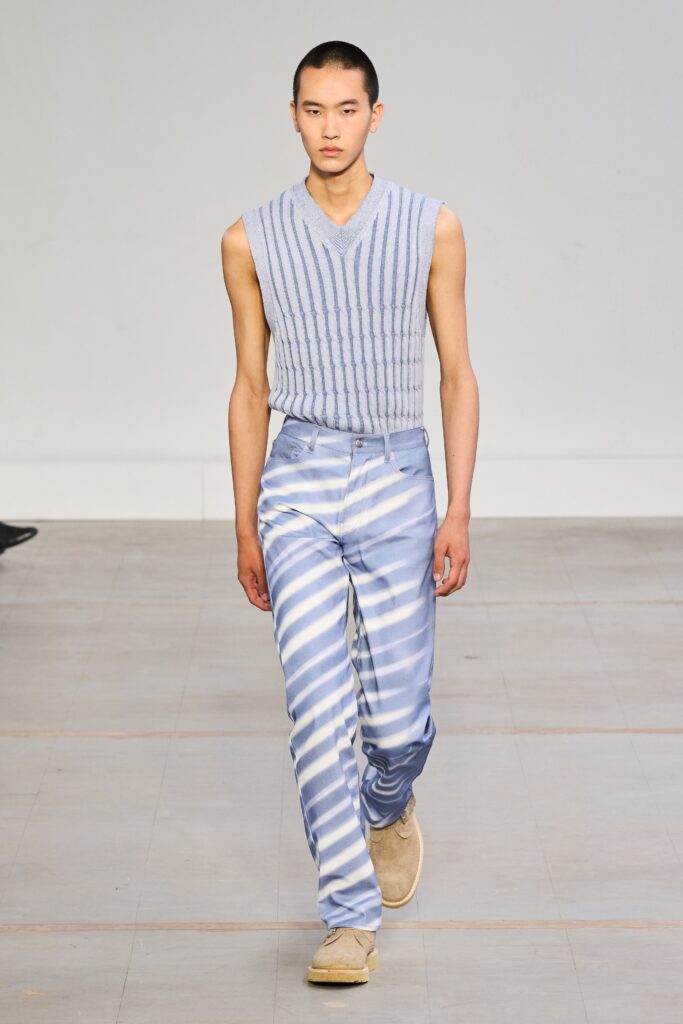 A fitted blue and white striped sleeveless top with a V-neck paired with matching pants.