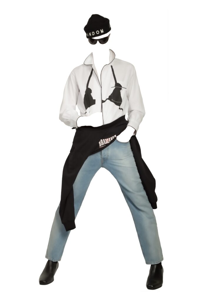 A relaxed white long-sleeve collared shirt paired with straight-leg blue denim pants.