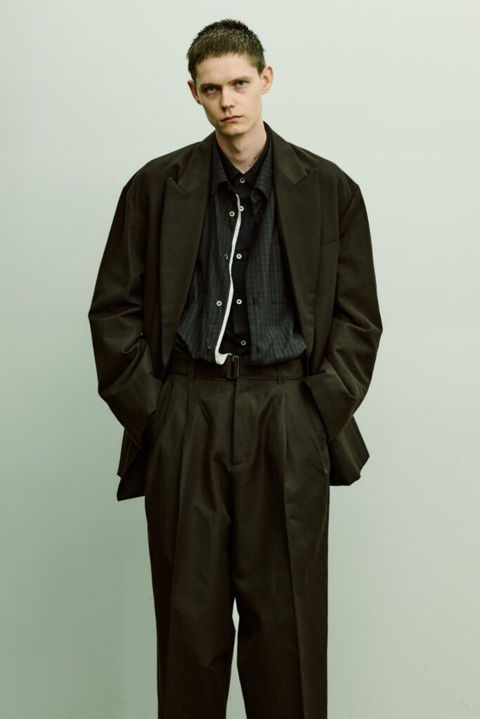 An oversized black tailored blazer paired with matching black pants for a sophisticated look.