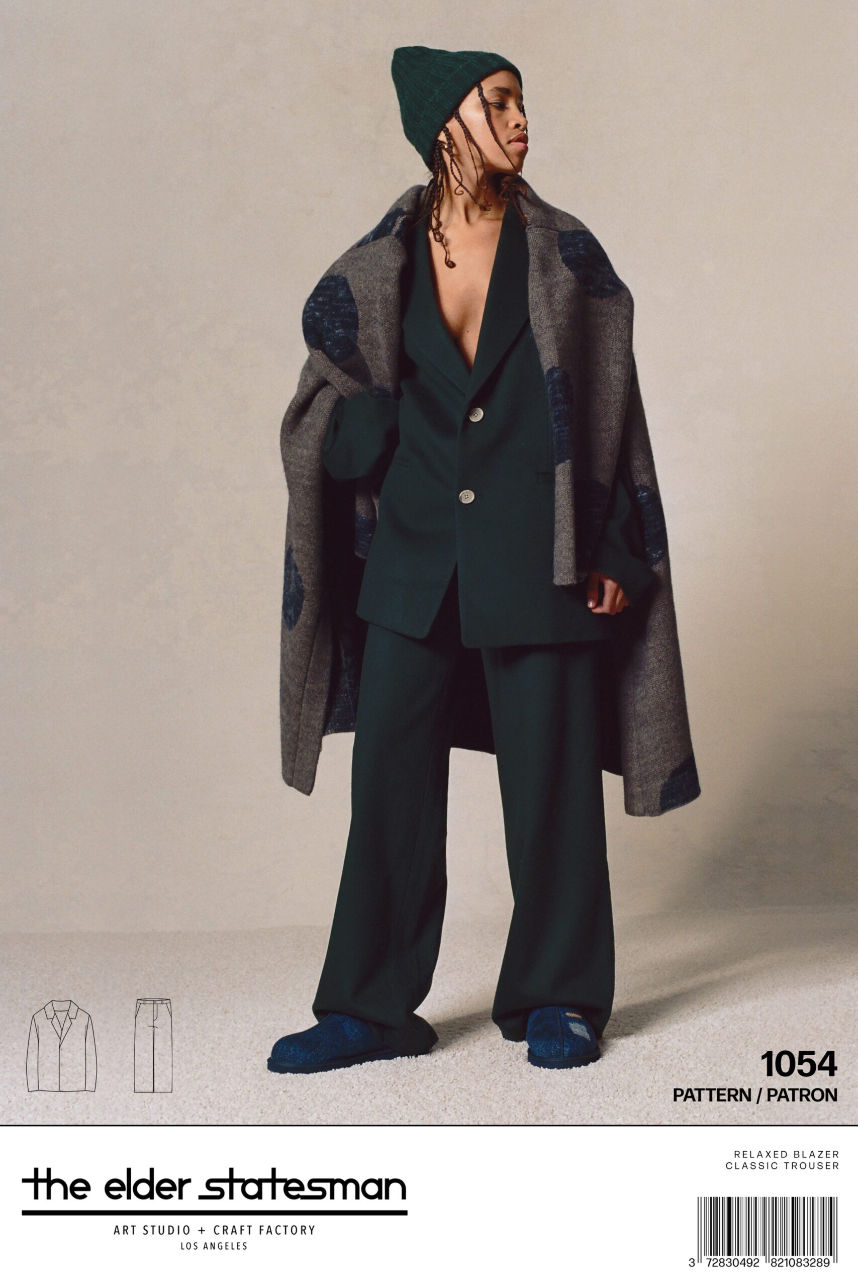 A relaxed green wool blazer with long sleeves and collared design paired with matching trousers.