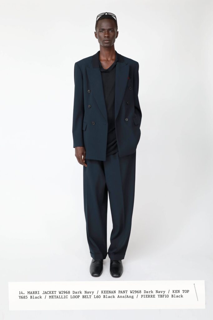 A relaxed black suit with a collared long-sleeve shirt and buttoned details.
