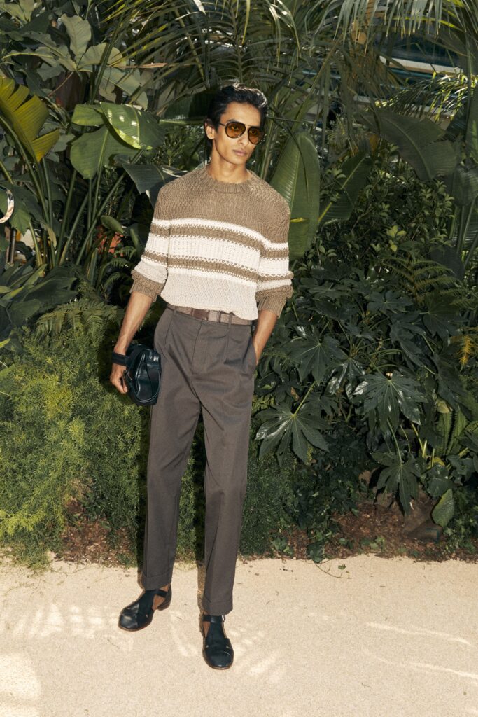 beige striped sweater with tailored pants