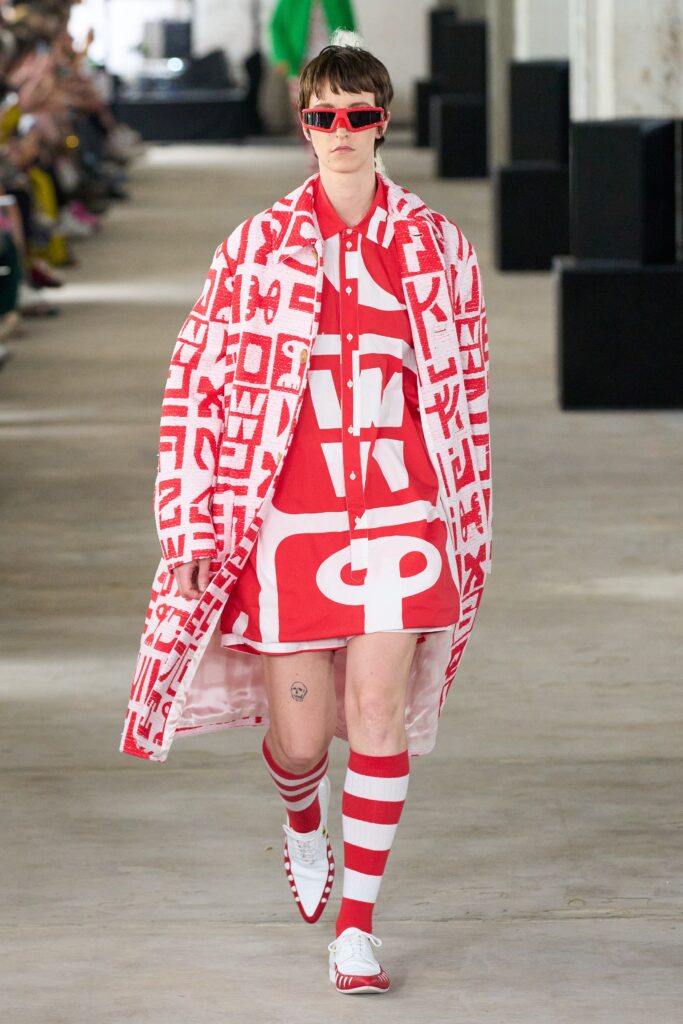 A relaxed red and white printed dress with a collared short-sleeve coat.